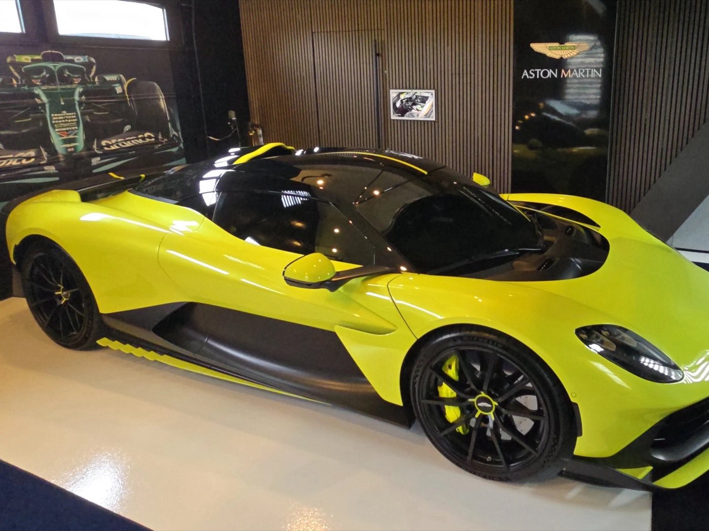 Aston Martin Valhalla on display under blue neon lighting