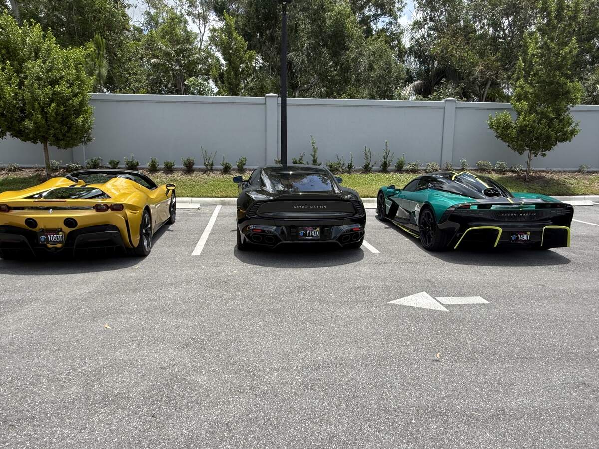 Three cars parked in a row